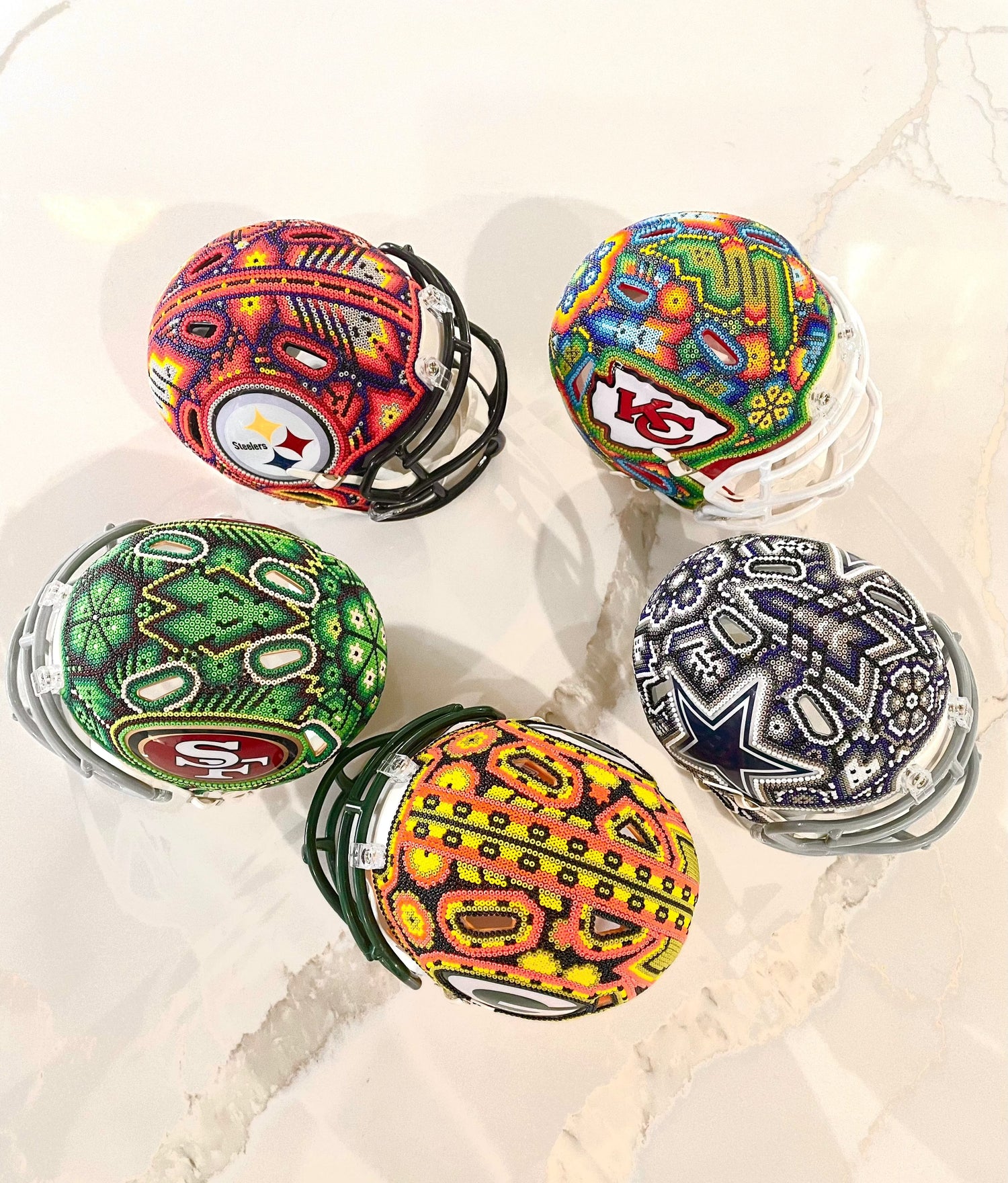 Your favorite NFL TEAM HUICHOL ART DECORATED mini helmet